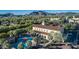 Aerial view of community center highlighting its amenities including pools, recreational areas, and lush landscaping at 20546 W Summit Pl, Buckeye, AZ 85396