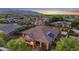 Beautiful aerial view of this residence featuring a tile roof, well-maintained landscaping, and solar panels at 20546 W Summit Pl, Buckeye, AZ 85396