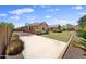 Expansive backyard with sports court, lawn, and mature landscaping for outdoor enjoyment at 20546 W Summit Pl, Buckeye, AZ 85396
