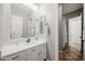 Bright bathroom featuring a white vanity and ample lighting at 20546 W Summit Pl, Buckeye, AZ 85396