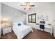 This bedroom has a ceiling fan, window with natural light and includes a desk work area at 20546 W Summit Pl, Buckeye, AZ 85396