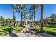Entrance of a community park featuring lush green space, pathways, and meticulously maintained landscaping at 20546 W Summit Pl, Buckeye, AZ 85396