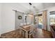 Dining room featuring a rustic barn door and sliding glass doors to the backyard at 20546 W Summit Pl, Buckeye, AZ 85396