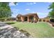 Charming single story home with covered entry, landscaped yard and lawn at 20546 W Summit Pl, Buckeye, AZ 85396