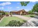 Charming single story home with covered entry, two car garage and lovely landscaping at 20546 W Summit Pl, Buckeye, AZ 85396