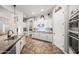 Modern kitchen with white cabinets, stainless steel appliances, and granite countertops at 20546 W Summit Pl, Buckeye, AZ 85396