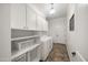 The laundry room is equipped with a washer and dryer and has storage at 20546 W Summit Pl, Buckeye, AZ 85396