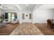 Spacious open floorplan with stylish furnishings, tile flooring, and plenty of natural light at 20546 W Summit Pl, Buckeye, AZ 85396