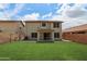 Expansive backyard with lush green lawn and a covered patio for outdoor living at 20734 N 38Th St, Phoenix, AZ 85050