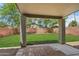 Inviting backyard with a covered patio, manicured lawn, and a peaceful ambiance for relaxation and outdoor enjoyment at 20734 N 38Th St, Phoenix, AZ 85050