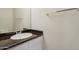 Clean bathroom with white sink and vanity with granite countertop, plus large mirror at 20734 N 38Th St, Phoenix, AZ 85050