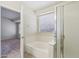 Bright bathroom featuring a bathtub and shower combination, complemented by natural light from the window at 20734 N 38Th St, Phoenix, AZ 85050