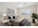 Well-lit bedroom with a cozy bed, stylish decor, and a large window offering pleasant natural lighting at 20734 N 38Th St, Phoenix, AZ 85050