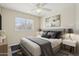 Comfortable bedroom features a cozy bed, modern lighting, and a serene atmosphere for restful nights at 20734 N 38Th St, Phoenix, AZ 85050