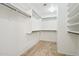 Walk-in closet with ample shelving and hanging space, perfect for organization and storage at 20734 N 38Th St, Phoenix, AZ 85050