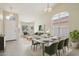 Bright dining room with modern table set and large windows, creating an inviting atmosphere for meals at 20734 N 38Th St, Phoenix, AZ 85050