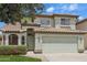 Charming two-story home with a well-maintained lawn, a two car garage, and a beautiful tile roof at 20734 N 38Th St, Phoenix, AZ 85050