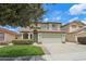 Charming two-story home featuring a well-maintained front yard and a welcoming facade at 20734 N 38Th St, Phoenix, AZ 85050