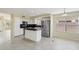 Well-lit kitchen with an island, stainless steel appliances, and sleek countertops at 20734 N 38Th St, Phoenix, AZ 85050