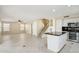 Open-concept kitchen and living space perfect for modern living, with tile flooring and ceiling fan at 20734 N 38Th St, Phoenix, AZ 85050