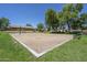 Community volleyball court in a park-like setting with trees and green grass at 20734 N 38Th St, Phoenix, AZ 85050