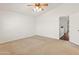 Carpeted bedroom features a ceiling fan and bright natural light at 20809 N 1St Ave, Phoenix, AZ 85027