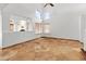 Inviting living area featuring travertine floors, high ceilings, a ceiling fan, and lots of natural light at 20809 N 1St Ave, Phoenix, AZ 85027