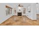 Bright living room with travertine flooring, a cozy fireplace, and an open layout perfect for entertaining at 20809 N 1St Ave, Phoenix, AZ 85027