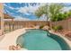 Sparkling pool with rock feature and basketball hoop in a private backyard setting at 20809 N 1St Ave, Phoenix, AZ 85027