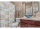 Bathroom featuring a vanity with a blue vessel sink and a shower with a beach themed shower curtain at 22166 N Lakeside Dr, Maricopa, AZ 85138