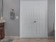 Bathroom featuring a towel rack and a closet with double doors at 22166 N Lakeside Dr, Maricopa, AZ 85138