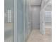 Bathroom featuring a walk in closet, bathtub and shower at 22166 N Lakeside Dr, Maricopa, AZ 85138