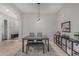 Dining room featuring a table with bench seating and stylish decor at 22166 N Lakeside Dr, Maricopa, AZ 85138