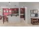 Inviting kitchen view with dark wood cabinetry, black appliances, and breakfast bar seating, perfect for entertaining at 22166 N Lakeside Dr, Maricopa, AZ 85138