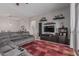 Comfortable living room with a large sectional sofa and entertainment center at 22166 N Lakeside Dr, Maricopa, AZ 85138