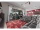 Cozy living room with a sectional sofa and a sliding glass door to the patio at 22166 N Lakeside Dr, Maricopa, AZ 85138