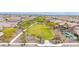 Aerial view of a well-planned community featuring a central green space and mature landscaping throughout at 22282 N 184Th Ln, Surprise, AZ 85387