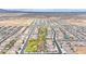 Wide aerial shot showcases a well-designed community with an expansive green space amidst a network of residential streets at 22282 N 184Th Ln, Surprise, AZ 85387