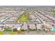 Expansive aerial view of the community showcasing a lush green park and well-maintained neighborhood streets at 22282 N 184Th Ln, Surprise, AZ 85387