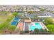 A beautiful aerial view shows a community pool, tennis courts, playground, and other recreational facilities at 22282 N 184Th Ln, Surprise, AZ 85387