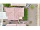 Aerial view of the property featuring the tile roof, landscaped backyard, and shaded outdoor dining area at 22282 N 184Th Ln, Surprise, AZ 85387