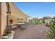 This backyard features a gravel-scape design with an open-air dining area shaded by a light-colored sun sail at 22282 N 184Th Ln, Surprise, AZ 85387