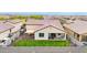The backyard is landscaped with desert landscaping with a covered patio and cozy dining area at 22282 N 184Th Ln, Surprise, AZ 85387