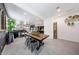 Open dining area with a modern table, open floorplan, and ample space for entertaining at 22282 N 184Th Ln, Surprise, AZ 85387