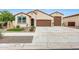Charming home featuring a desert-friendly landscaped front yard and a spacious two-car garage at 22282 N 184Th Ln, Surprise, AZ 85387