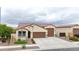 This front exterior features a well-maintained lawn, desert landscaping, and a three-car garage, all with neutral tones at 22282 N 184Th Ln, Surprise, AZ 85387