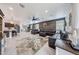 Open-concept living room with an accent wall, plush seating, and stylish decor at 22282 N 184Th Ln, Surprise, AZ 85387