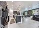 The open-concept kitchen and living area feature modern appliances and stylish decor at 22282 N 184Th Ln, Surprise, AZ 85387