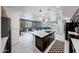 A spacious open concept living area boasts a modern kitchen and stylish furnishings at 22282 N 184Th Ln, Surprise, AZ 85387