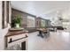 Open concept space with wood-look accent wall, ample lighting, and contemporary dining set at 22282 N 184Th Ln, Surprise, AZ 85387